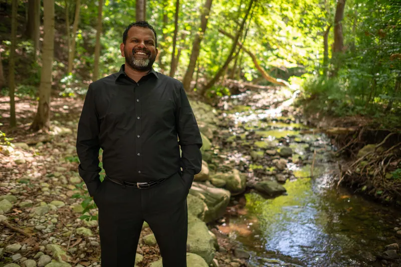 Jeyas Balaskanthan beside Laurel Creek